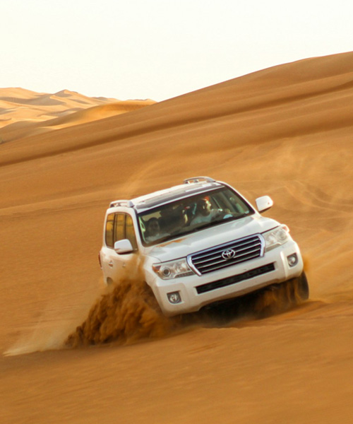 dune bashing with Overnight Desert Safari