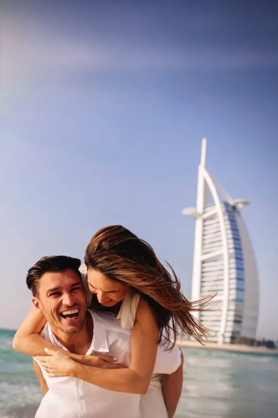 couple at burj al arab with Dubai Honeymoon Packages