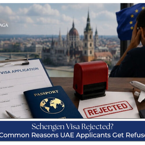 UAE resident reviewing a Schengen visa rejection letter with passport and application documents