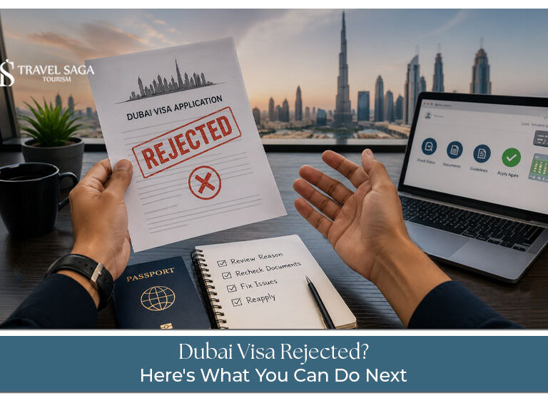 Traveler reviewing a rejected Dubai visa application with passport and documents.