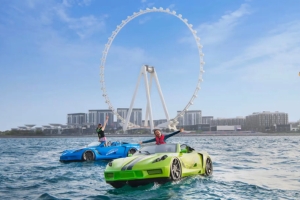 Riders on jet cars near Ain Dubai wheel in Dubai