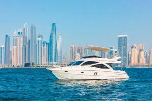 Luxury yacht charter sailing along Dubai Marina waterfront