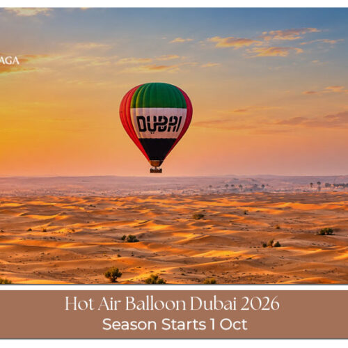 Hot air balloon rising over the Dubai desert during an early morning flight.