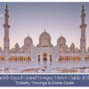 Visitors admiring the grand white domes and intricate architecture of Sheikh Zayed Grand Mosque.