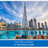 Visitors enjoying panoramic views of Dubai's skyline from the Burj Khalifa observation deck during golden hour.