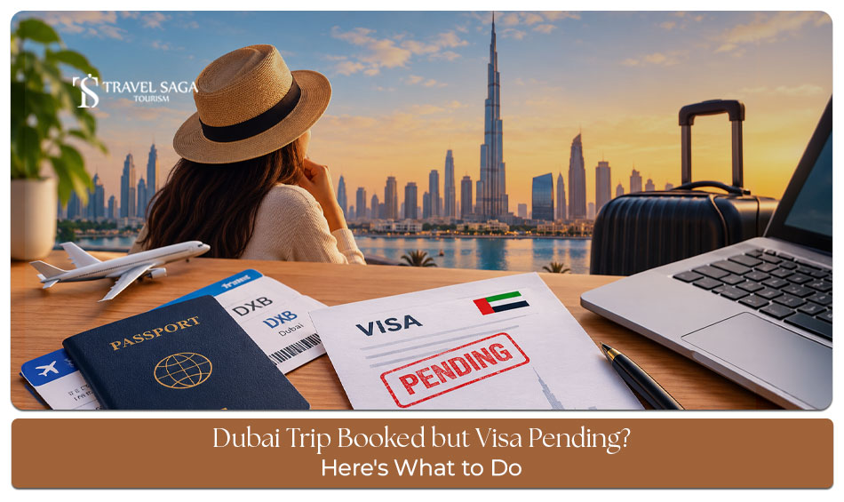 Traveller checking a pending visa application on a laptop beside a passport and confirmed Dubai flight booking.