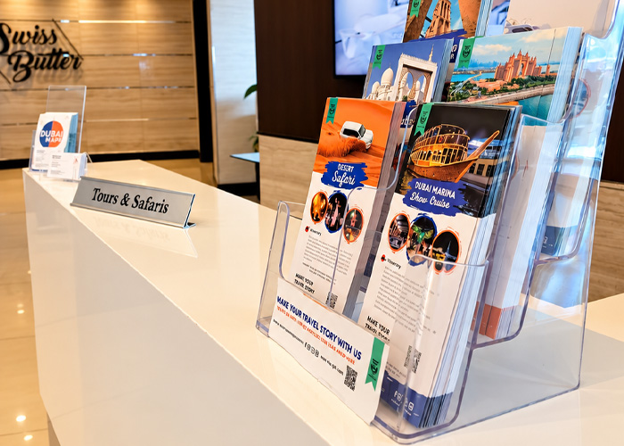 Travel Saga Dubai tours and safaris brochures displayed at the travel desk