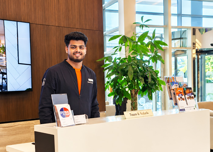 Travel Saga Tourism staff member at the Dubai tours and safaris desk